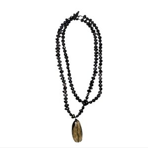 Elegant Black Beaded Necklace with Gold Pendant
